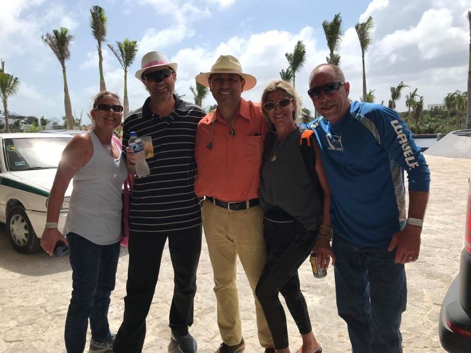 Happy travellers with their Yakata driver in Cancun